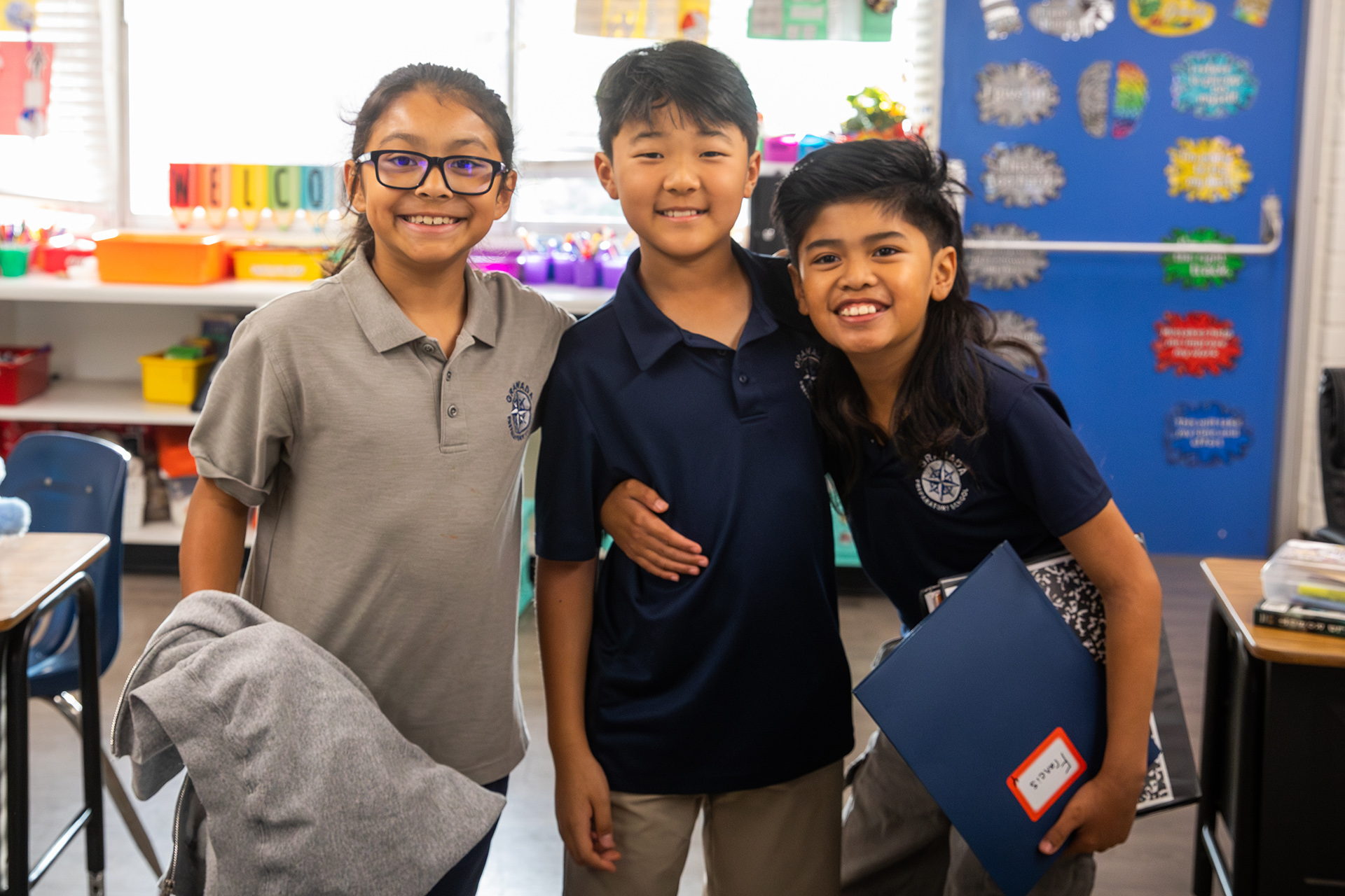 GPS teacher welcoming families at classroom door